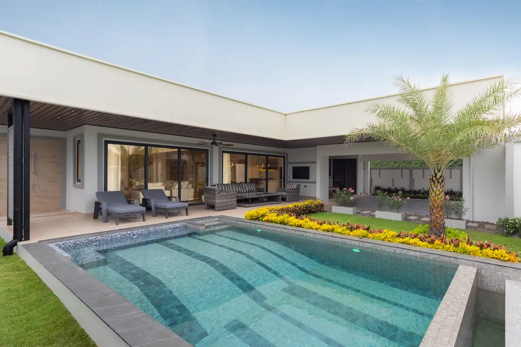 Private pool and garden at the show villa